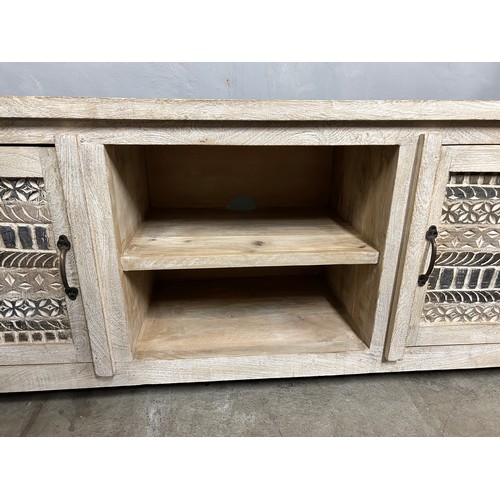 3038 - A wooden TV cabinet with a sandblast antique white finish