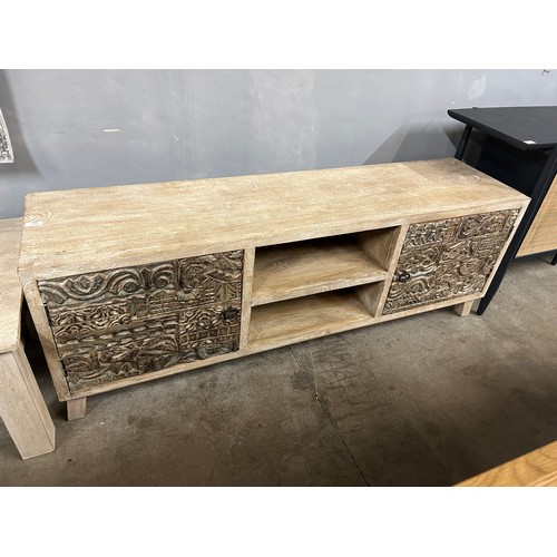 3041 - A wooden TV cabinet with a sandblast antique white lime finish