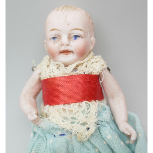 2229 - A small doll and a later celluloid doll marked Japan