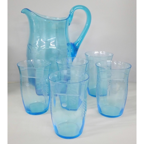 2260 - A Tuscan Decoro Pottery vase, crazed, a blue glass vase, a blue glass water jug and five glasses, on... 