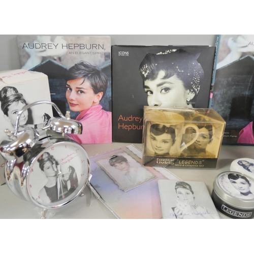 2289 - A collection of Audrey Hepburn items including two clocks, books, etc.