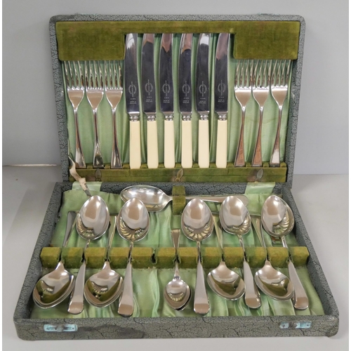 2290 - A four piece plated tea service and a collection of flatware, etc.