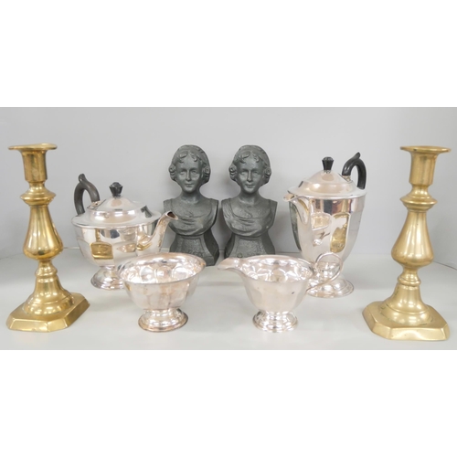 2300 - A pair of cast iron fire dog busts, a pair of brass candlesticks and a collection of A1 plated ware