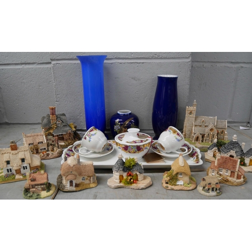 2317 - A collection of eleven Lilliput Lane Cottages and Church plus a Limoges tea set, two blue vases and ... 