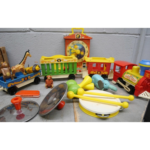 2329 - A collection of vintage Fisher Price toys