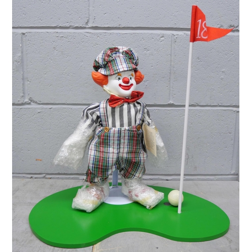 2348 - A Victoria Impex Corporation model of a clown, boxed, a doll on rocking chair and four large resin f... 