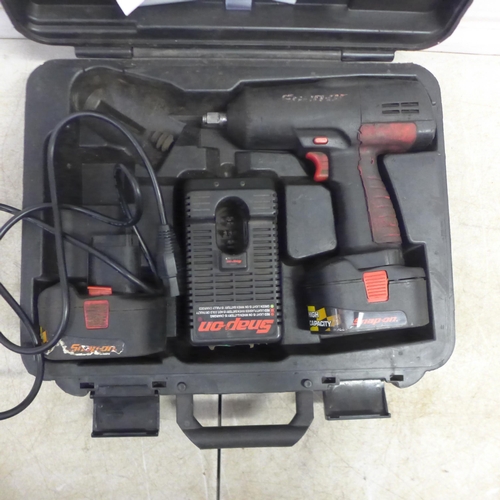 5032 - A Snap-On cordless impact wrench with 2 batteries and charger