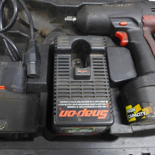 5032 - A Snap-On cordless impact wrench with 2 batteries and charger