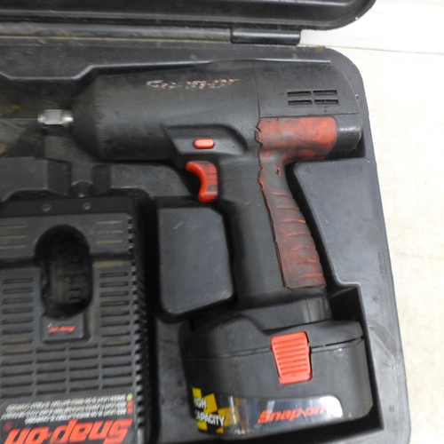 5032 - A Snap-On cordless impact wrench with 2 batteries and charger