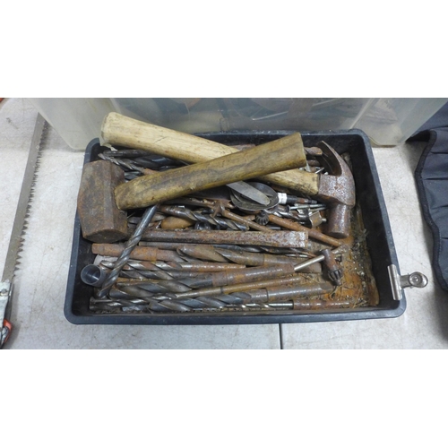 5052 - A box of assorted handtools including brace bits, assorted saws, oil stones, hammers, etc.