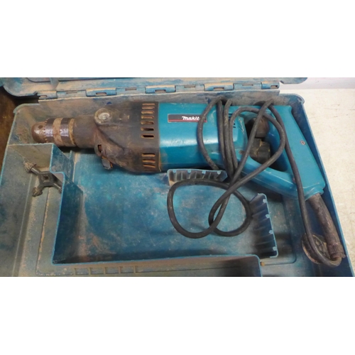 5057 - A Makita 8406 hammer drill in case with Black and Decker DN710 power plane and a Workzone pendulum j... 