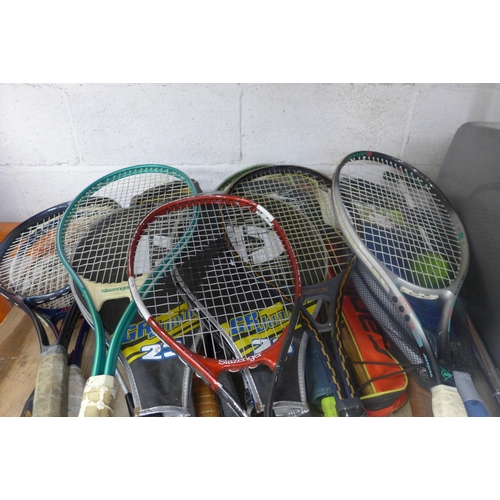 5197 - A quantity of sports equipment and walking sticks including tennis, badminton, hockey, a pogo stick,... 