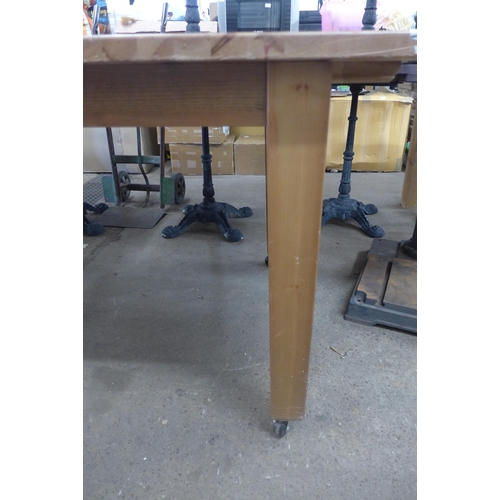 5224 - A wooden extending dining table on wheels