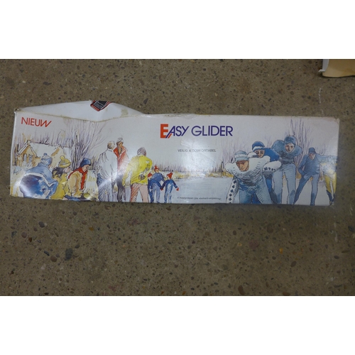 5305 - Two sets of Easyglider skates and an artist drawing box