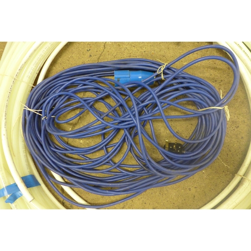 5333 - A coil of water pipe, a coil of electric wire and a coil of fencing wire