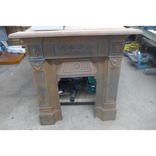 5355 - A Victorian Aesthetic Movement cast iron fire surround