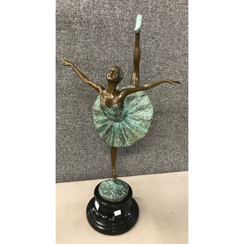 335 - A French style bronze figure of a female ballet dancer, on black marble socle