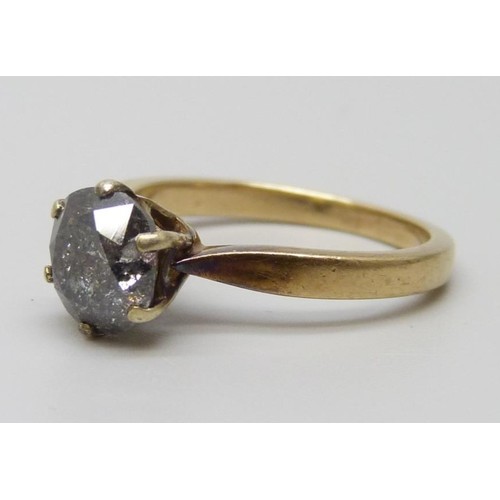 7078 - A 9ct gold and diamond ring, 3.4g, N/O, (chip on the rim of the stone, many carbon inclusions)