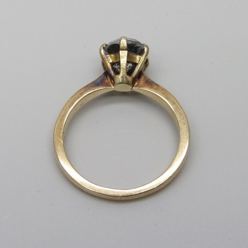 7078 - A 9ct gold and diamond ring, 3.4g, N/O, (chip on the rim of the stone, many carbon inclusions)