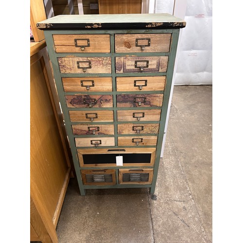 3185 - A rustic, distressed wooden set of seventeen drawers