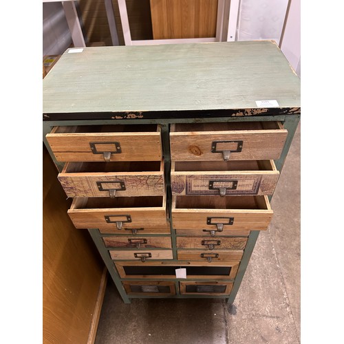 3185 - A rustic, distressed wooden set of seventeen drawers