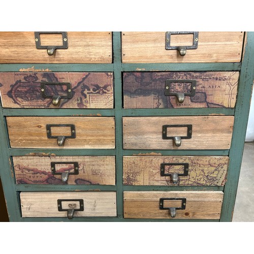 3185 - A rustic, distressed wooden set of seventeen drawers