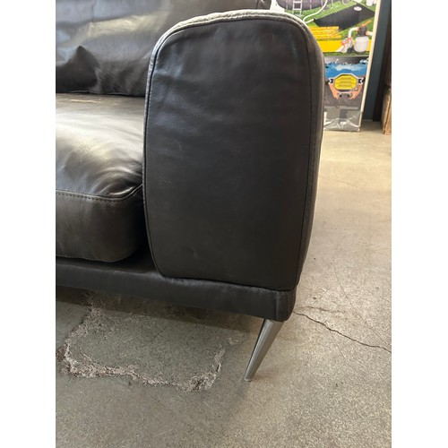 3204 - A dark grey leather love seat (worn)