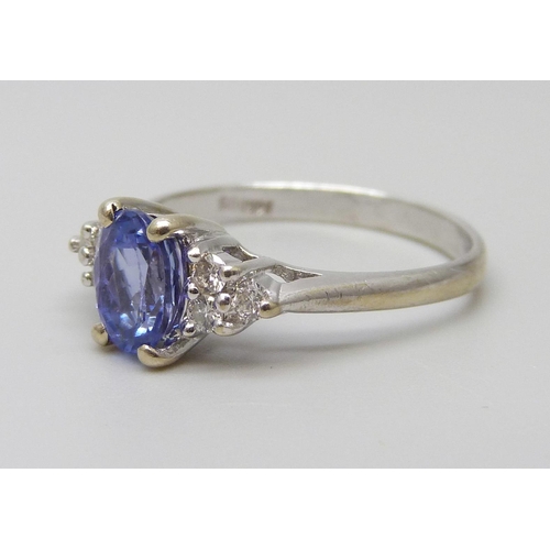 7354 - A 14ct/585 white gold, tanzanite and diamond ring, size O, 2.6g