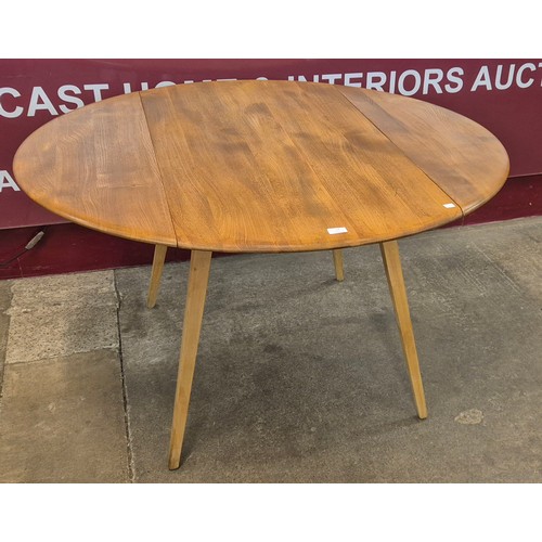 17 - An Ercol elm and beech Windsor drop leaf table