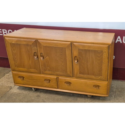 16 - An Ercol Blonde elm Windsor sideboard