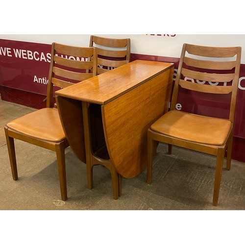 26 - A Nathan teak drop leaf table and three chairs