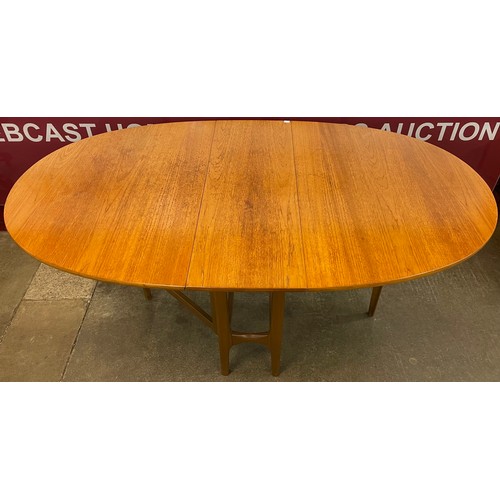 26 - A Nathan teak drop leaf table and three chairs