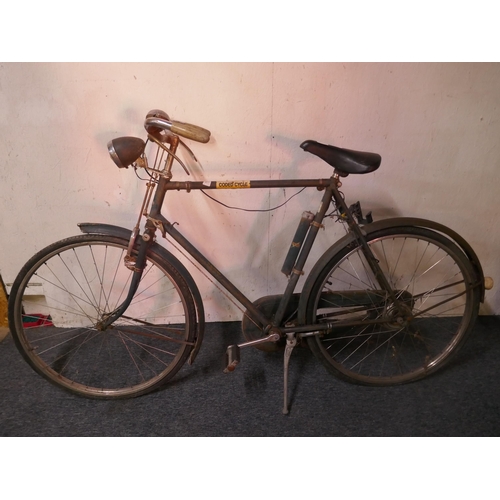 8006 - A vintage Raleigh 'All Steel' road bike fitted with mud guards and headlamp