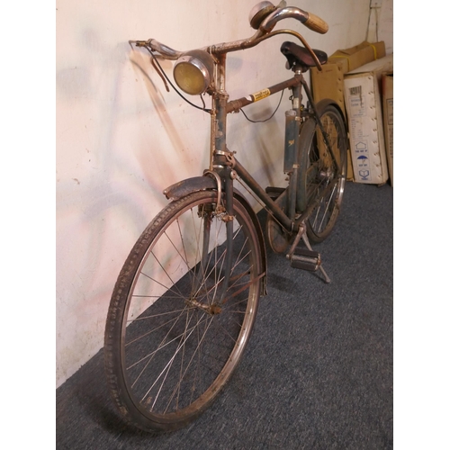 8006 - A vintage Raleigh 'All Steel' road bike fitted with mud guards and headlamp