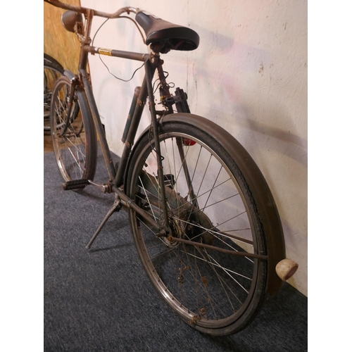 8006 - A vintage Raleigh 'All Steel' road bike fitted with mud guards and headlamp