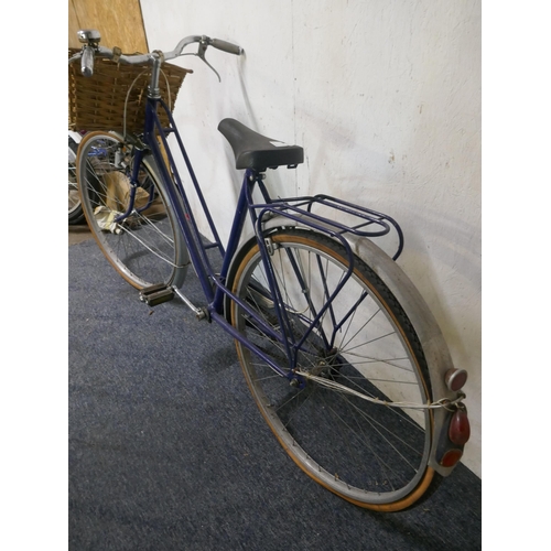 8118 - A vintage Step Through framed bike with mud guards, front basket and pannier rack