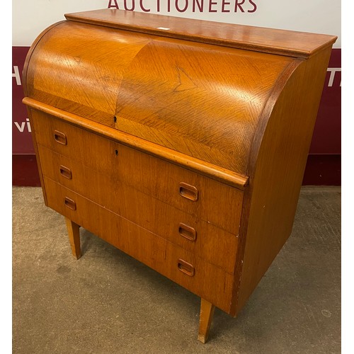 34 - A Swedish S.M.I teak cylinder bureau, designed by Egon Ostergaard