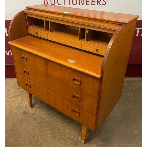 34 - A Swedish S.M.I teak cylinder bureau, designed by Egon Ostergaard