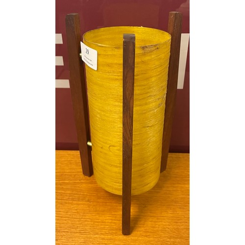 29 - A desk top teak and yellow fibreglass rocket lamp