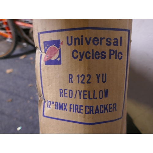 8074 - A boxed Universal Cycles red and yellow 12