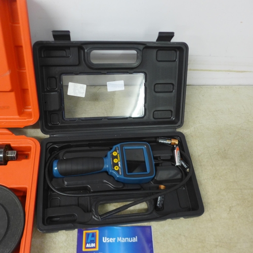 5013 - 3 cased tools - a Workzone inspection camera, a plastic welding gun and a spring compression kit