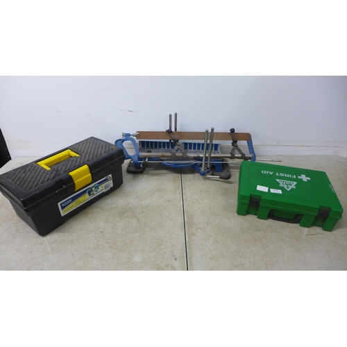 5048 - A tool box with drill bits, a first aid box and a manual mitre saw