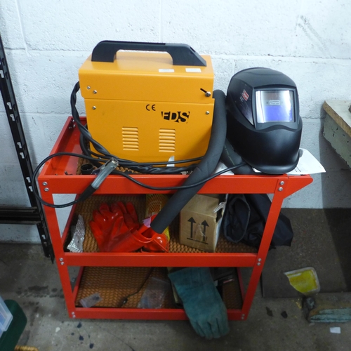 5064 - An FDS MIG 130 no gas MIG welder with 3 level tool trolley and a quantity of welding equipment inclu... 