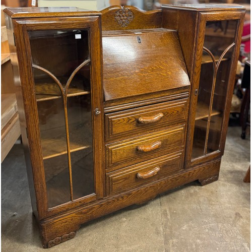 187 - An early 20th Century oak side by side bureau bookcase