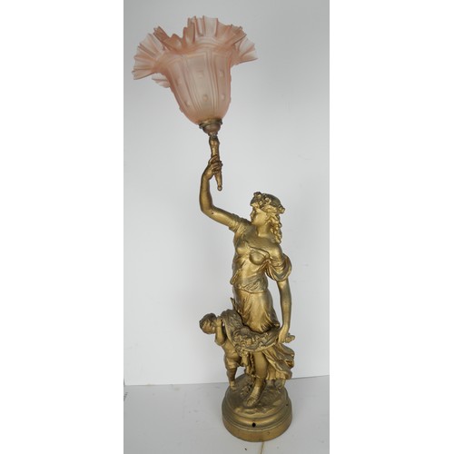 9055 - An Art Nouveau gilt metal lamp by Newel, in the form of a lady