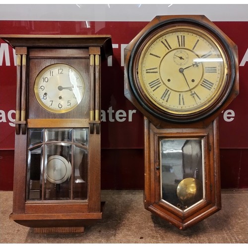 9059 - An early 20th century oak cased wall clock and a drop dial wall clock