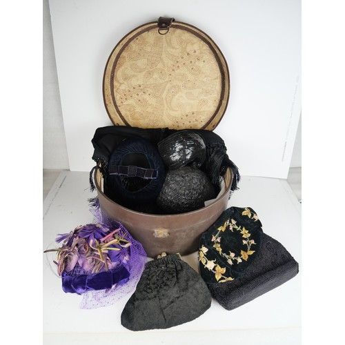 9060 - A hat box containing assorted hats, evening bags and a shawl