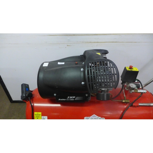 5042 - A Clarke Raider Air 15/1000 3HP compressor with a box of attachments including air hoses, inflators,... 