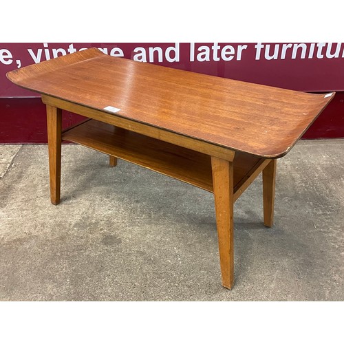 48 - A teak sleigh top coffee table