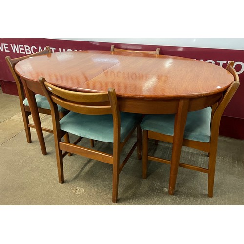 53 - A Jentique teak oval extending dining table and four teak and fabric upholstered dining chairs